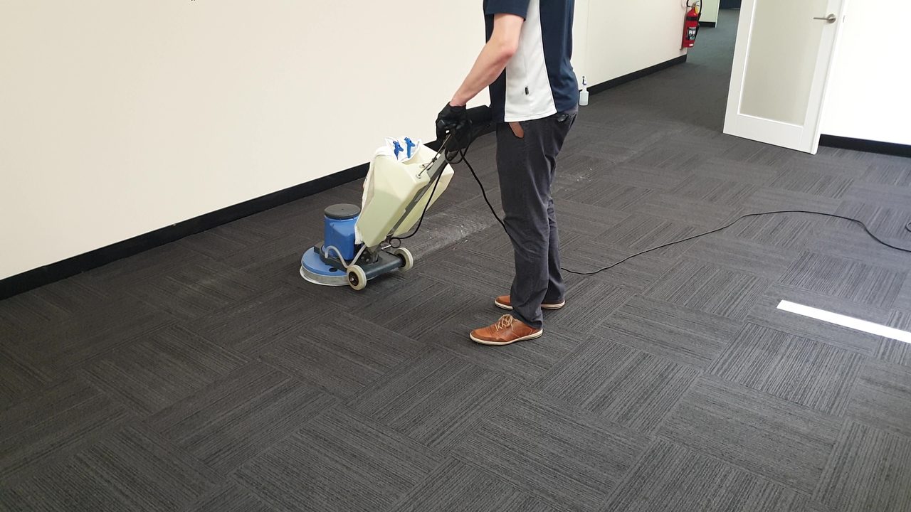 Make good carpet cleaning in an empty Perth office tenancy, every grey striped carpet tile scrubbed before the keys go back