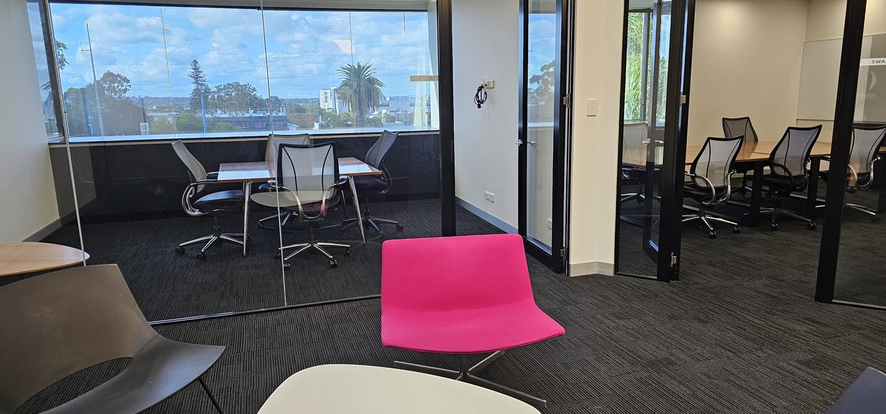 Fabric seating and meeting rooms in a Perth office, where chairs, screens and carpet all collect the same dust and skin oils