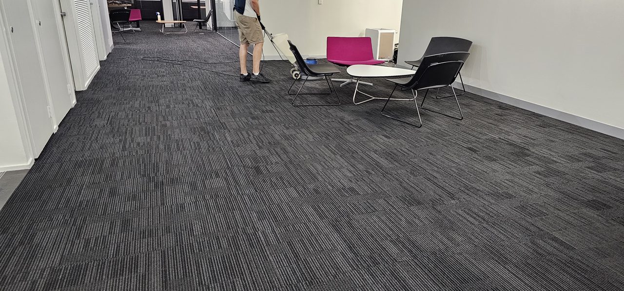 A Perth office break-out area of charcoal carpet tiles, where coffee, tea and soft drink spills land and get cleaned out