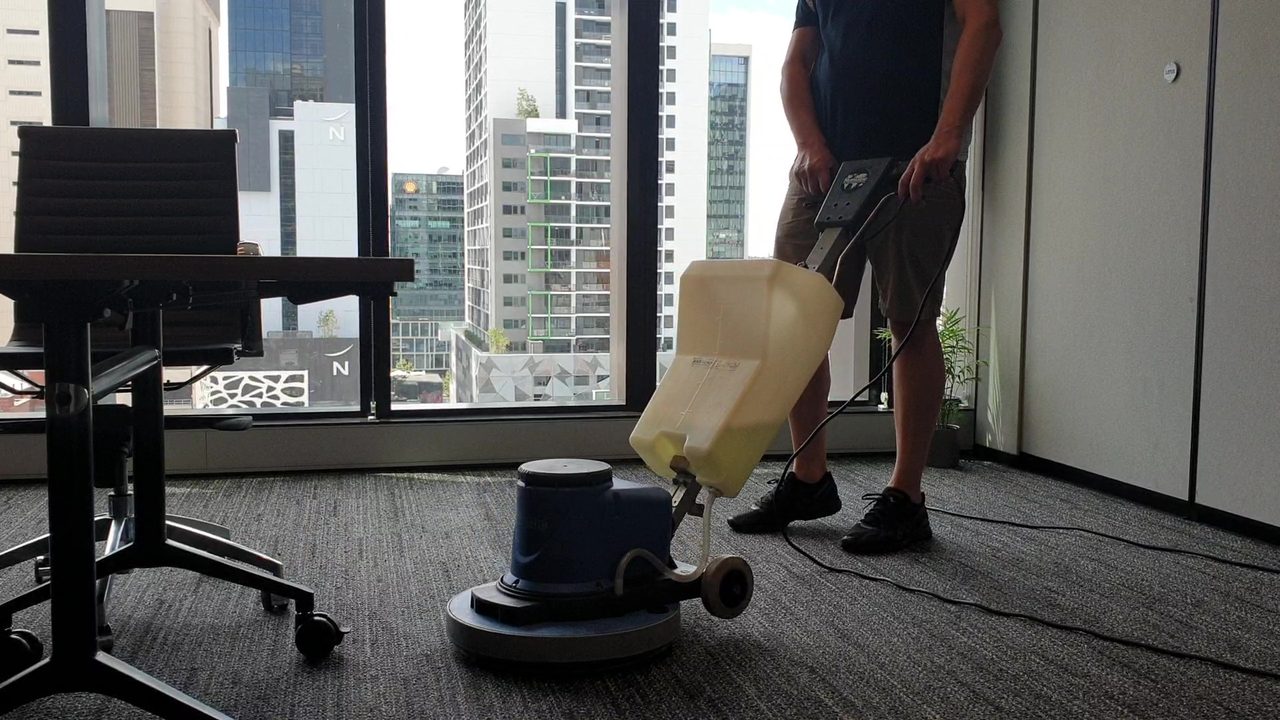 Carpet cleaning on an upper floor of a Perth city tower, where lift bookings and loading dock access shape the day