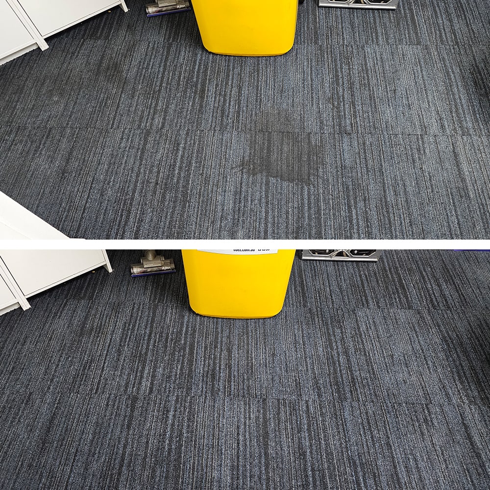 Dark spill stains on blue striped carpet tiles in a Perth office, removed to leave the tiles clean and uniform