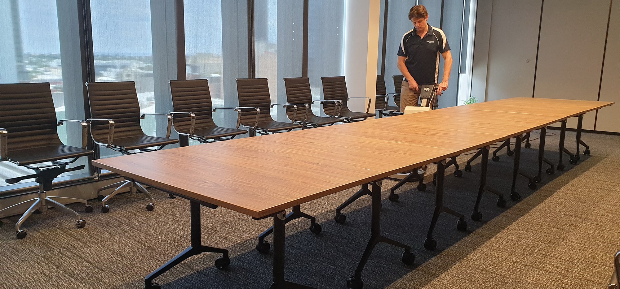 Boardroom carpet cleaned under and around a long meeting table in a Perth office tower