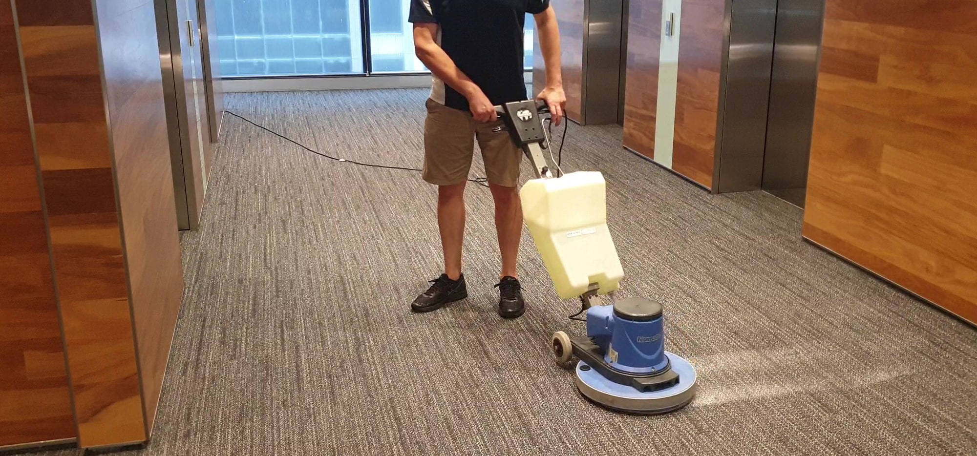 Lift lobby carpet cleaned in a Perth office building, keeping the arrival point for tenants and visitors sharp