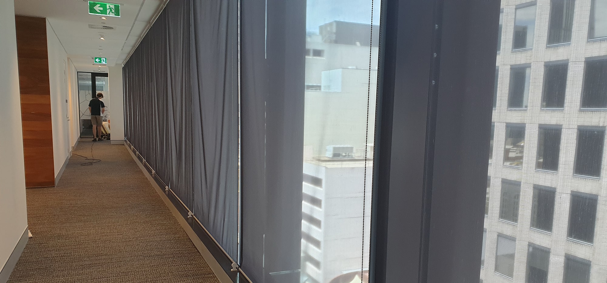 A long corridor beside the windows of a Perth city office, its carpet cleaned from one end to the other