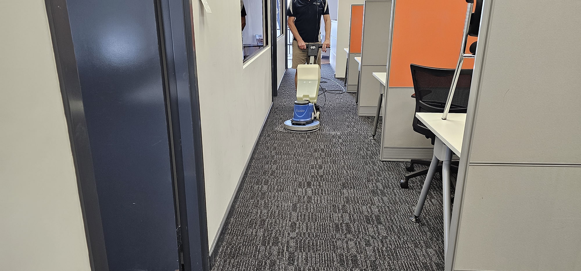Carpet cleaned along a narrow Perth office aisle between workstations, our machine covering the full length of the walkway