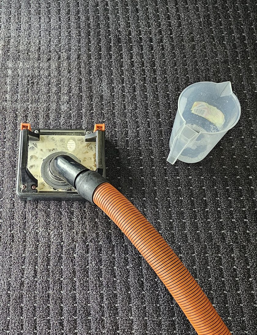 Flood extraction on the carpet tiles of a Perth office, pulling the water from the joins and the slab beneath.