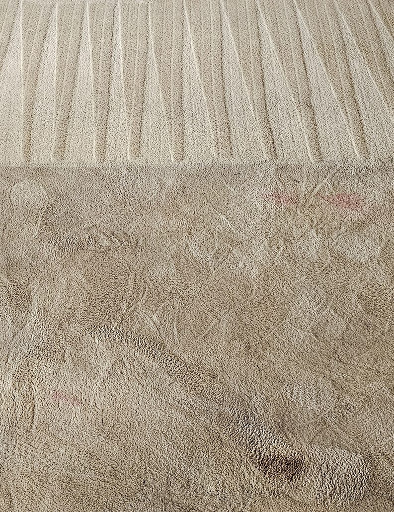A cream wool carpet in Perth part-way through our steam clean, the cleaned passes bright against the soiled pile still to be done.