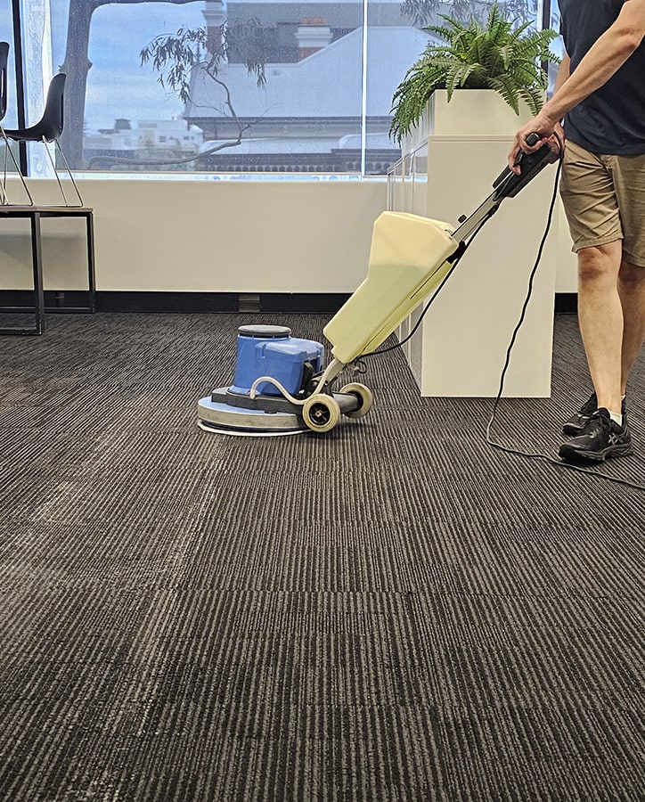 Perth office carpet cleaner in action cleaning carpets in West Perth.