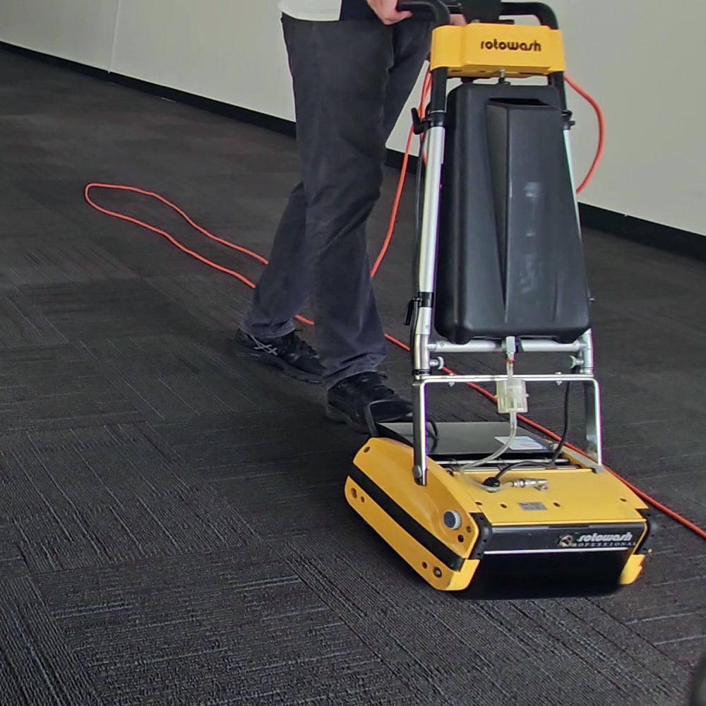 A commercial carpet cleaner cleaning carpets.
