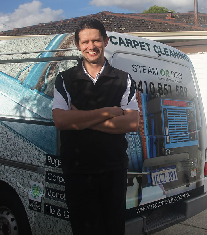 Perth carpet cleaning technician standing in front of his van.