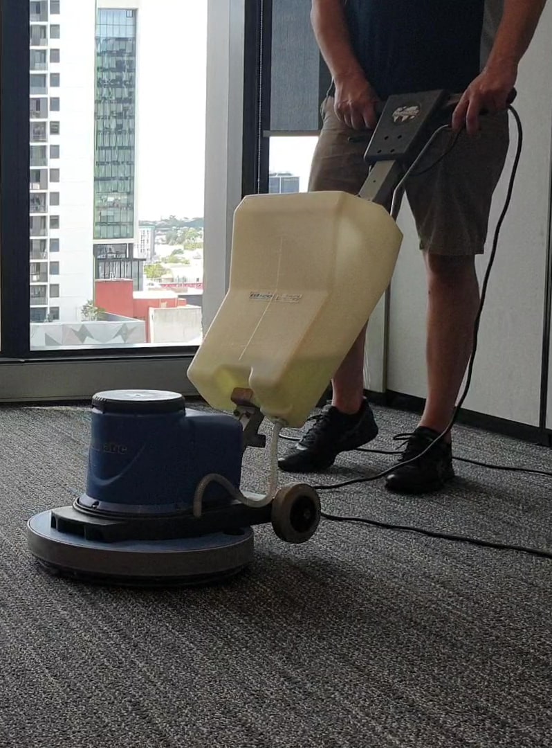 A cleaner cleaning carpets.